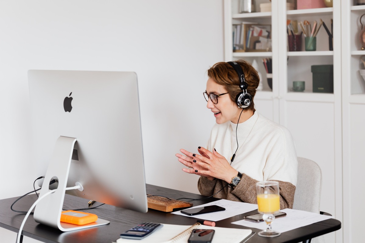 teletherapy Detroit participant using headphones for a private video call